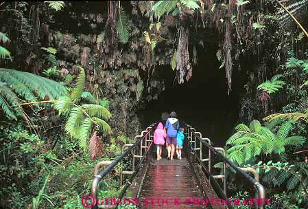 Stock Photo #13135: keywords - big cave caves dark earth ecology eerie enter geologic geological geology hawaii hawaiian hike hikers hiking horz island land lava national natural nature park parks people rainforest science thurston tropical tube tubes volcanic volcano volcanoes walk walking