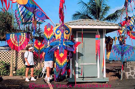 Stock Photo #13157: keywords -  attraction banner banners big color colorful destination hawaii hawaiian horz island islands kailua kona leisure people shop tourist travel tropical vacation windsock windsocks