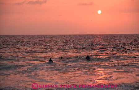 Stock Photo #13172: keywords -  big dark dusk evening hawaii hawaiian horz island islands kailua kona ocean people recreation sea sport sunset sunsets swim swimming tropical vacation water