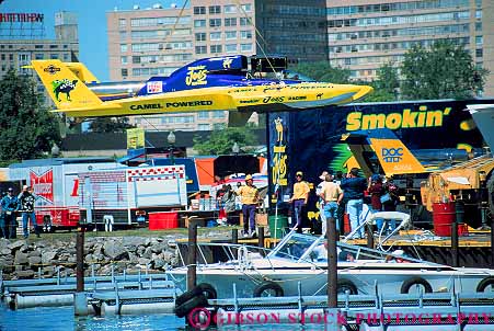 Stock Photo #12247: keywords -  aerodynamic boat boating boats colorful competition contest crane detroit fast horz hydroplane hydroplanes lift lifting lifts michigan power preparation race racer races river sleek speed speedboat speedboats speeding speeds
