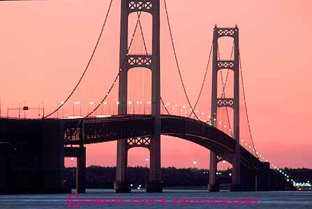 Stock Photo #13226: keywords - across arch arched arches bridge bridges cable cables cross curve curved curves curving dark deck dusk engineer engineered engineering evening great highway horz lakes landmark landmarks lighting lights long mackinac mackinaw michigan midwest over region road roadway scenery scenic span spanning spans sunset suspended suspension tall tower towers transportation