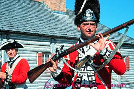 Stock Photo #3391: keywords -  antique colonial costume dress era flintlock fort historic history horz living michigan michilimackinac model red reenactment released rifle soldier