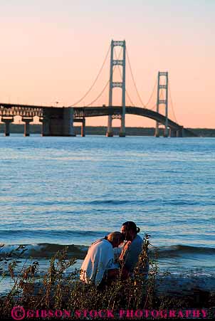 Stock Photo #13227: keywords - affection affectionate bridge bridges caring city couple couples evening great intimacy intimate lakes loving mackinac mackinaw michigan midwest near privacy private region sensitive summer together vert