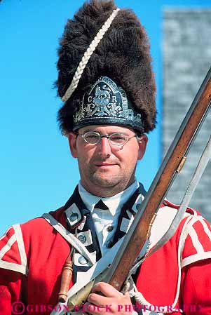 Stock Photo #13231: keywords -  city colonial costume costumed era flintlock fort forts great historic lakes mackinaw michigan michilimackinac midwest old region released soldier soldiers uniform uniforms vert vintage