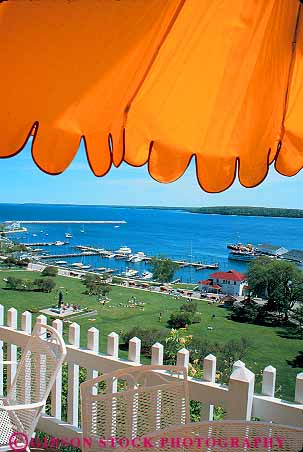 Stock Photo #12059: keywords -  attraction color colorful destination elevate elevated fence island islands landscape landscapes mackinac michigan overview picket resort resorts scenery scenic summer tourist travel umbrella under vert view yellow
