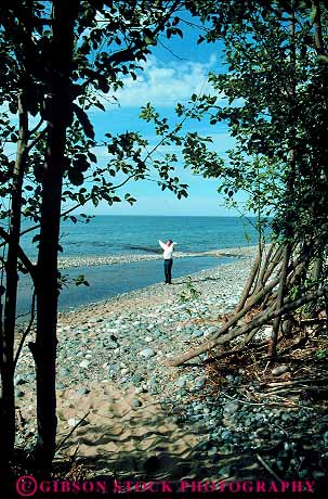 Stock Photo #13242: keywords - alone arm arms beach beaches fresh freshwater give great lake lakes lakeshore michigan national outreach outreached outreaching park parks peninsula pictured pictures praise praises praising privacy private raised reach reaches reaching region released rocks solitary solitude stand standing superior thanks up upper upward upwards vert walk walking woman women