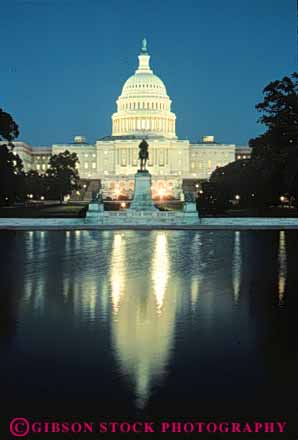 Stock Photo #8743: keywords -  america american americana architecture building buildings capitol capitols columbia dark dc design district dome domes dusk evening federal government headquarters illuminate illuminates lighted lights national night of office reflect reflecting reflection reflects states united us usa vert washington