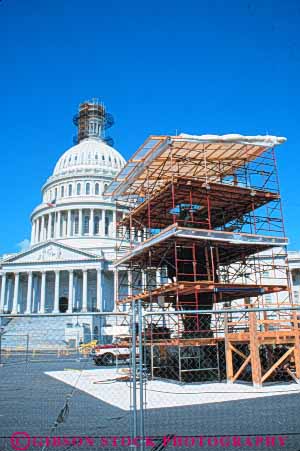 Stock Photo #8751: keywords -  america american americana architecture building buildings capitol capitols columbia construction dc design district dome domes federal government headquarters job national of office repair repairing repairs restoration restore restores restoring save scaffold scaffolding site states united usa vert washington