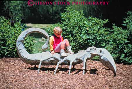Stock Photo #8785: keywords - animal artificial attraction child columbia dc destination display district fake giant girl h horz insect model museums national of oversized playground plays public released scorpion tourist travel uge washington zoo