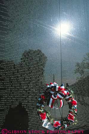 Stock Photo #8796: keywords -  attraction black blue columbia dc decorate decoration destination display district engrave engraved memorial memorialize memorials memory monument monuments nam name names of polish polished public red reflect reflecting reflection reflects remember remembering remembrance shiny stone tourist travel tribute tributes vert viet vietnam war wars washington white wreath