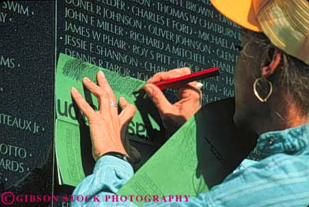 Stock Photo #8799: keywords -  attraction black columbia dc destination display district engrave engraved horz makes memorial memorialize memorials memory monument monuments nam name names of polish polished public reflect reflecting reflection reflects remember remembering remembrance rubbing shiny stone tourist travel tribute tributes viet vietnam war wars washington woman