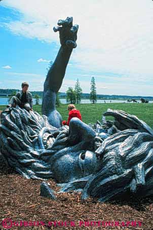 Stock Photo #8814: keywords -  art attraction awakening big city climb columbia dc destination different district face giant huge man metal of p park parks people playground potomac public sculpture sculptures tourist travel ublic unique unusual vert washington