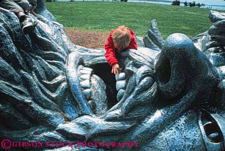 Stock Photo #8815: keywords -  art attraction awakening big city climb columbia contrast contrasts dc destination different district face giant girl head horz huge man metal mouth of park parks people playground potomac public released sculpture sculptures size teeth tourist travel unique unusual washington