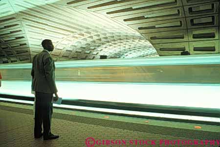 Stock Photo #8940: keywords -  architecture central columbia commute commuter commuters commutes commuting dc district horz light lightrail man mass metro modern moving near of public rail railroad railroads rapid service stands stark station subterrainian subway subways track tracks train trains transit transport transportation transporting transports underground urban washington