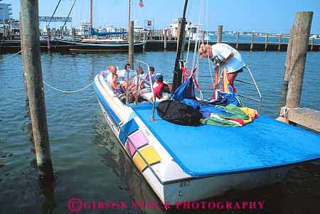 Stock Photo #12423: keywords -  activity adventure boat boats city group horz marina maryland ocean parasail parasailing parasails play preparations prepare prepares preparing recreation trip