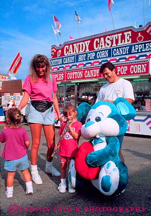 Stock Photo #12424: keywords -  activity annual children event events fair fairs family father festival festivals fun husband maryland mother parent parents play playing prize prizes recreation state summer timonium together vert warm wife win winning won