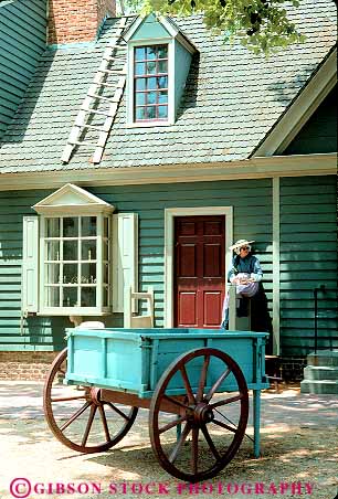 Stock Photo #11575: keywords -  american building buildings colonial colony community costumed early era front heritage historic history in living museum museums of old preserve preserved recreate recreated reenact reenacted reenacting reenactment restoration restore restored revolution shop site vert virginia wagon wagons williamsburg woman
