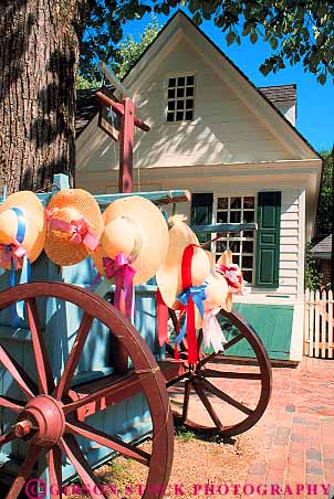 Stock Photo #11576: keywords -  american building buildings colonial colony community early era hat hats heritage historic history living museum museums old preserve preserved recreate recreated reenact reenacted reenacting reenactment restoration restore restored revolution site straw vendor vendors vert virginia wagon wagons williamsburg