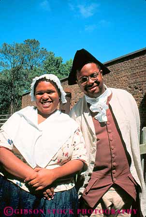Stock Photo #11580: keywords -  african american black building buildings colonial colony community costume costumed couple early era ethnic heritage historic history living man minority museum museums old people person play portray portraying preserve preserved recreate recreated reenact reenacted reenacting reenactment released restoration restore restored revolution role site vert virginia williamsburg woman