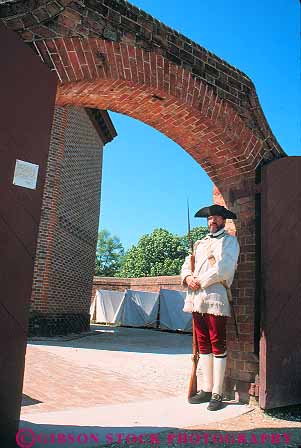 Stock Photo #11584: keywords - american battery building buildings colonial colony community costume costumed early entrance era guard heritage historic history living museum museums old people person preserve preserved recreate recreated reenact reenacted reenacting reenactment restoration restore restored revolution site soldier vert virginia williamsburg