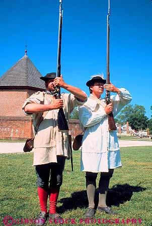 Stock Photo #11585: keywords -  american building buildings colonial colony community costume costumed dressed early era flint heritage historic history living lock military museum museums old people person portray portraying preserve preserved recreate recreated reenact reenacted reenacting reenactment released restoration restore restored revolution rifle site soldier soldiers vert virginia williamsburg