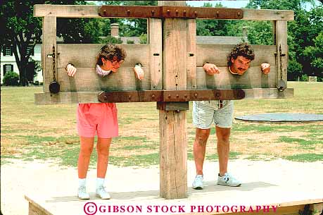 Stock Photo #11588: keywords -  american building buildings colonial colony community couple early era heritage historic history horz in living lock locked museum museums old people person preserve preserved pretend prison recreate recreated reenact reenacted reenacting reenactment restoration restore restored revolution simulate simulated site stockade virginia williamsburg