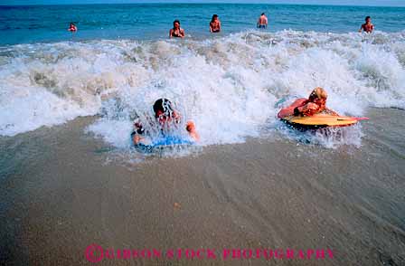 Stock Photo #12355: keywords -  beaches boy boys bright children chincoteague coast coastal horz hot in island kid kids ocean play playing resort sand shore splash summer sun sunny sunshine surf swim swimming vacation virginia water wave waves