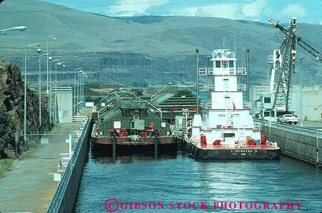 Stock Photo #13344: keywords -  barges columbia commerce dalles gorge horz in industry lock locks oregon pushing river rivers ship shipping ships transportation tug tugboat water