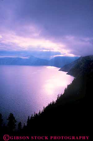 Stock Photo #13357: keywords - caldera calderas cloud clouds color crater craters dawn formation geologic geological geology glare glares glaring lake lakes moisture mood moody national oregon park parks public purple reflection reflects vert volcanic volcano volcanoes water weather