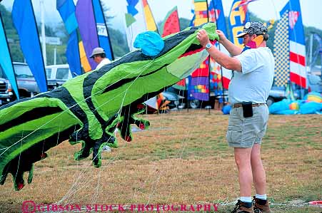 Stock Photo #13384: keywords - brookings coast coastal coastline coasts fair fairs festival festivals horz kite kites man material nylon oregon sets shore shoreline shores synthetic up