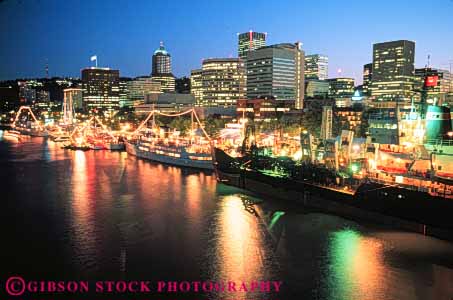 Stock Photo #7609: keywords -  america american architecture bright building buildings business center cities city cityscape cityscapes display downtown evening festival horz lighting lights modern navy new night office oregon portland river rose ship ships skyline skylines urban usa water willamette
