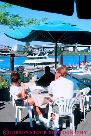 Stock Photo #11239: keywords - cafe cafes couple dine dining marina oregon outdoor outside patio people place portland relax relaxed relaxing river summer sunny umbrella umbrellas vert warm waterfront