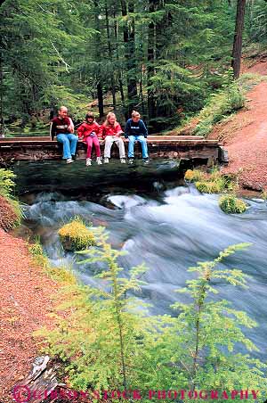 Stock Photo #13418: keywords - bridge clearwater conifer coniferous conifers creek fall falls forests four friend friends girl girls group groups landscape landscapes natural nature near northwest oregon rainforest released river scenery scenic scenics sit sits sitting stream summer temperate tree trees tributary umpqua vert water waterfall waterfalls wood