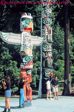 Stock Photo #12063: keywords -  american art british canada carve carved colorful columbia display displays exhibit exhibits in indian municipal native painted park parks people pole poles public recreation sculpture sculptures season stanley summer symbol symbolic totem vancouver vert