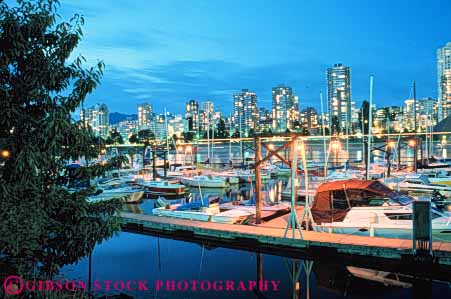 Stock Photo #7617: keywords -  architecture boat boats british building buildings business calm canada canadian center cities city cityscape cityscapes columbia dark downtown evening flat harbor harbors horz light lighting marina modern new night office skyline skylines still urban vancouver water