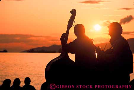 Stock Photo #12386: keywords - base british cello columbia dark dusk evening fiddle horz jam music musician musicians outside session silhouette sound summer sunset sunsets vancouver warm