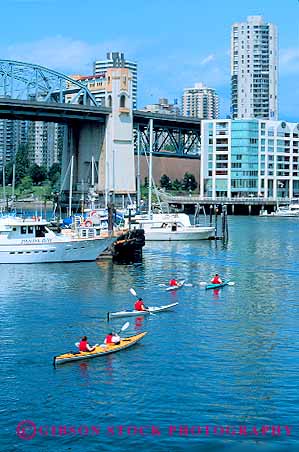 Stock Photo #12071: keywords -  boat boater boating boats british canada cities city columbia depart float floating granville harbor harbors island kayak kayaker kayakers kayaking kayaks marina marinas paddle paddlers paddles paddling people recreation season sport sports summer vancouver vert
