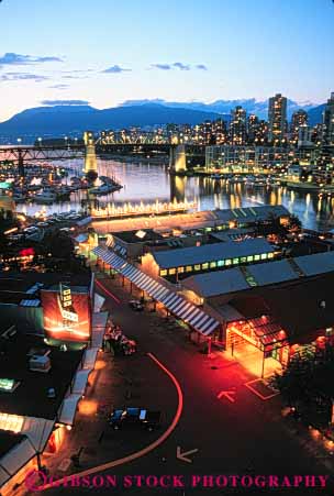 Stock Photo #7619: keywords - architecture boat boats british building buildings business canada canadian center cities city cityscape cityscapes columbia dark downtown elevated evening granville harbor harbors island lights modern new night office skyline skylines urban vancouver vert view water
