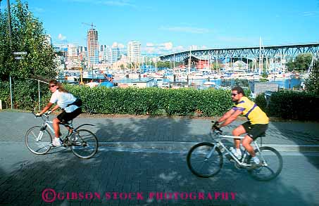 Stock Photo #12402: keywords - bicycle bicycles bicycling bike bikers bikes british columbia couple granville horz island man peddle peddling recreation ride riding roll rolling sport summer vancouver woman