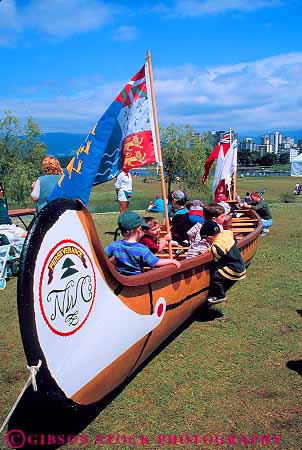 Stock Photo #12077: keywords - big boat boats boy boys british canada canoe canoes child children childrens columbia festival giant gigantic huge in large oversized people play recreation vancouver vert wood wooden