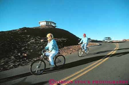 Stock Photo #13505: keywords - bicycle bicycles bike bikes coast coasting coasts down downhill geologic geological geology gravity haleakala hawaii hawaiian horz island maui national park parks people public recreation ride rider riders rides riding road roll rolling rolls slope sport summit volcanic volcano