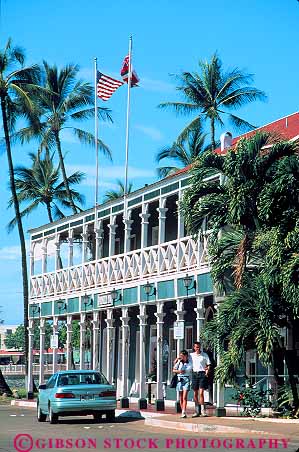 Stock Photo #13518: keywords - architecture balconies balcony building couple couples design destination hawaii hawaiian historic hotel hotels inn inns islands lahaina landmark landmarks maui people pioneer porch porches site sites style tradition traditional travel tropical vacation vert wood wooden