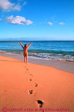 Stock Photo #3569: keywords -  alone beach beaches carefree child clean expression footprint free freedom girl happy hawaii joy kid kids landscape maui ocean outdoor recreation released safe sand sandy scenic sea solitary solitude spirit spirited summer surf travel vert walk warm water wilderness