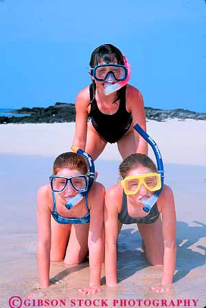 Stock Photo #11411: keywords -  beach beaches children destination dive equipment friend friends fun girl girls hawaii human in kneel kneeling ocean play playing portrait pyramid recreation released sand sea snorkel splash stack surf three travel vacation vert water wave waves