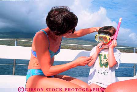 Stock Photo #13560: keywords - activities activity child children daughter dive diver divers dives diving fun girl hawaii hawaiian help helping helps horz kid leisure mask maui mother ocean outdoor outside parent people person play playing plays recreation released sea single snorkel snorkeler snorkeling sport sports sunny sunshine tropical vacation warm water with woman