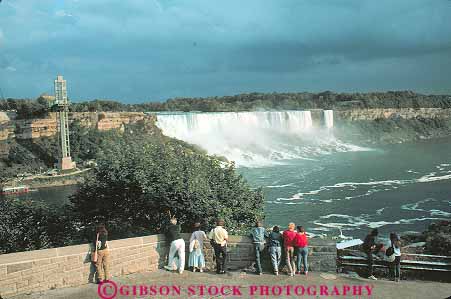 Stock Photo #13573: keywords -  churn churning churns erode eroded erodes eroding erosion fall falling falls flow flowing flows freshwater gravity great group groups horz lakes landmark landmarks lawrence new niagara people river rivers saint st st. tourist tourists turbulence turbulent view viewing water waterfall waterfalls york