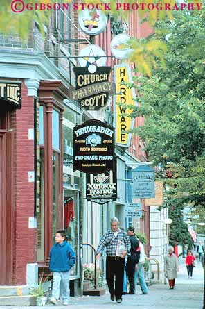 Stock Photo #13581: keywords -  advertise advertising buildings business cooperstown copperstown district main new pedestrian pedestrians people shop shoppers shops sidewalk sidewalks sign signs small street streets town towns vert york