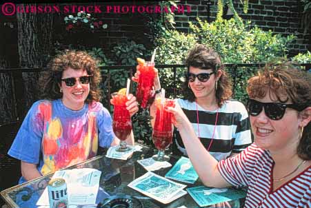 Stock Photo #8523: keywords -  alcohol cafe cafes destination drink drinking drinks friend friends group horz hurricane louisiana new obriens orleans pat recreation restaurant restaurants sisters smile smiles smiling sunglasses three toast tourist tourists travel travelers usa vacation with woman women