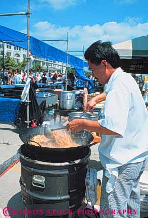 Stock Photo #8529: keywords -  asian chef cook cooking cooks destination ethnic fair fairs festival festivals food fry jazz louisiana minority new orleans outdoor outside recreation stir travel usa vacation vendor vert wok