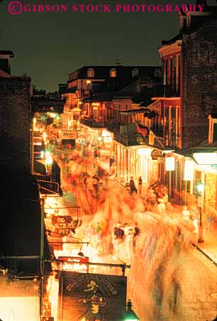 Stock Photo #7620: keywords -  america american architecture bourbon building buildings cities city dusk evening french light lighting lights louisiana new night orleans quarter road street urban usa vert